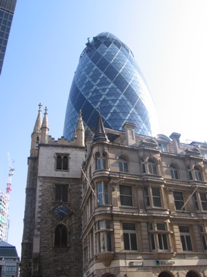 The Gherkin rising behind an old building